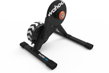 Wahoo KICKR CORE 2 smart bike trainer with black frame and orange resistance knob