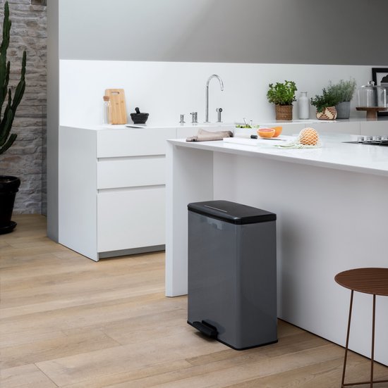 Curver Decobin 65L rectangular trash can with black lid and grey body in modern kitchen