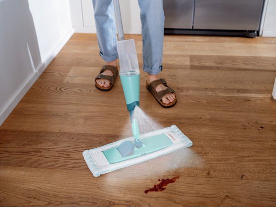Leifheit Easy Spray XL floor mop with spray mechanism in turquoise and white on wooden floor
