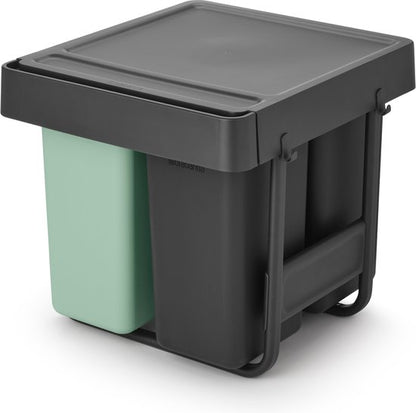 Brabantia Sort & Go pull-out waste bin with mint green and black compartments