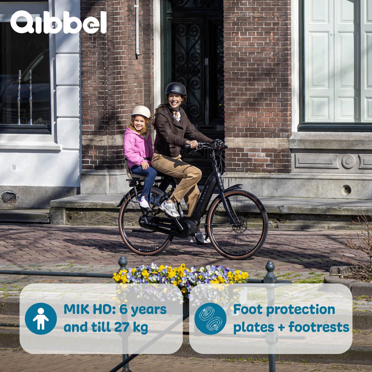 Qibbel Junior rear bike seat with child and adult cyclist on street, brown and pink