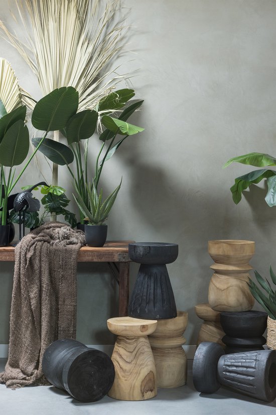 WOOOD Borre wooden stool in black and natural wood tones, styled with potted plants and decorative accessories