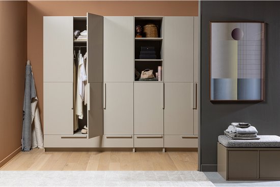 Modern cream and taupe modular wardrobe system with open shelving and closed storage cabinets